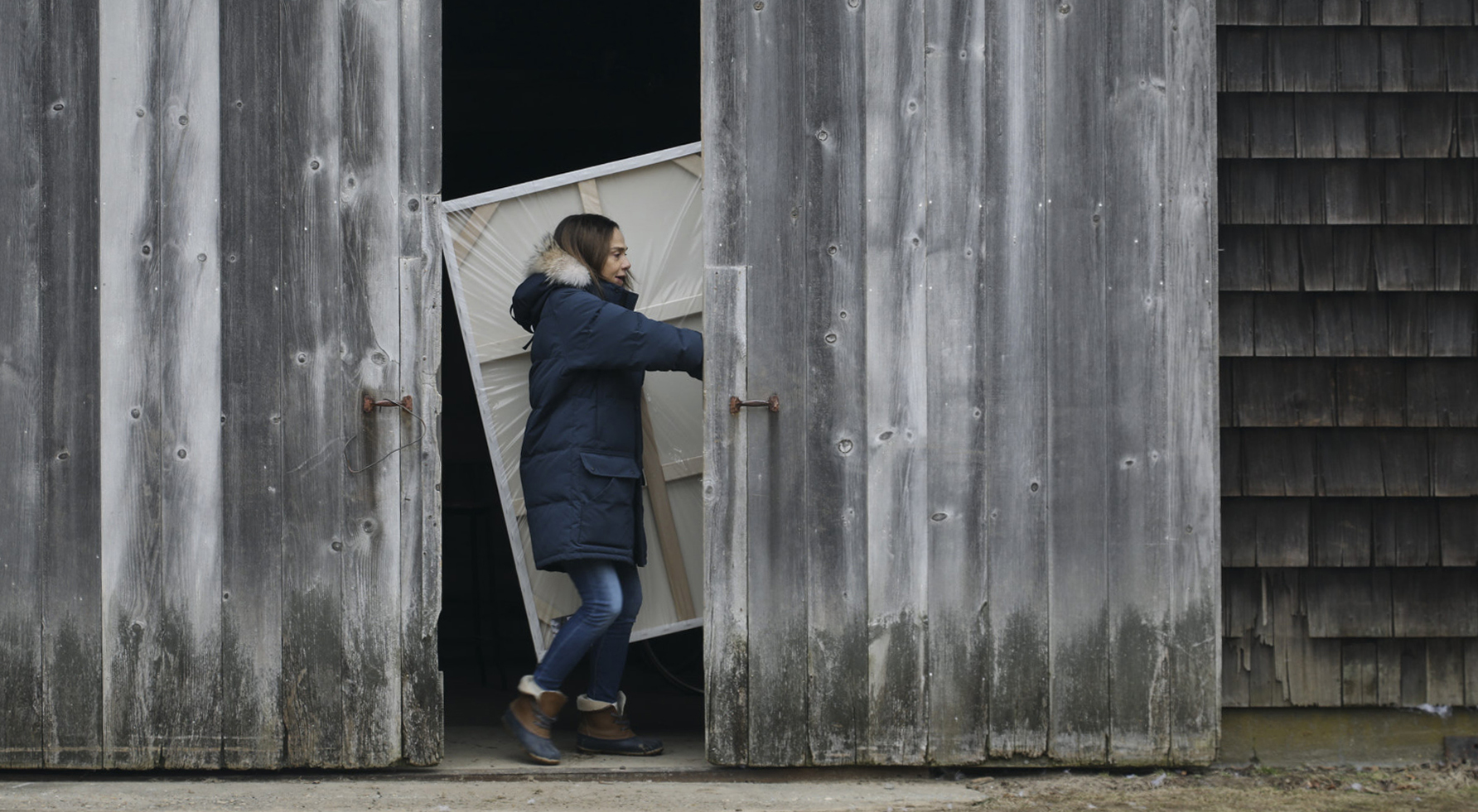 Claire (Lena Olin) enters her new barn studio in THE ARTIST’S WIFE. Photo by Michael Lavine.
